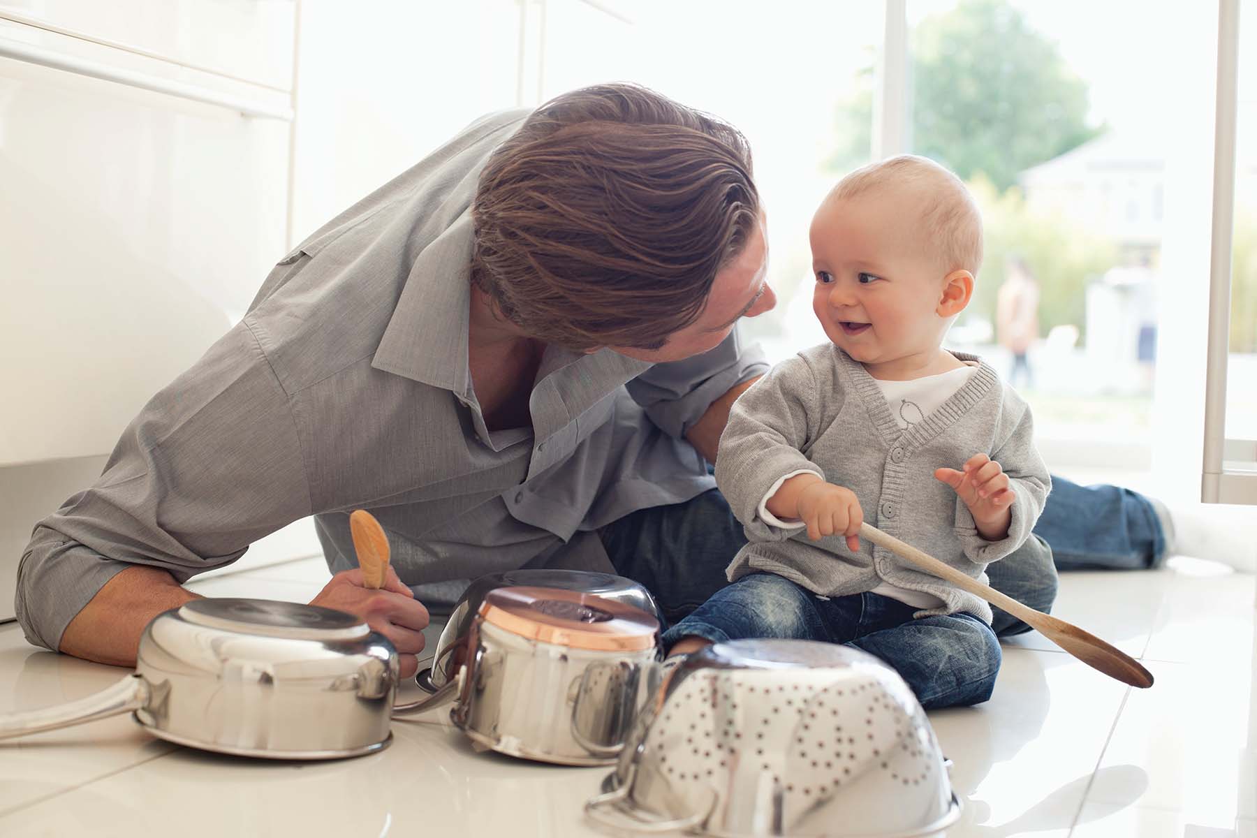 parent and child playing on the floor